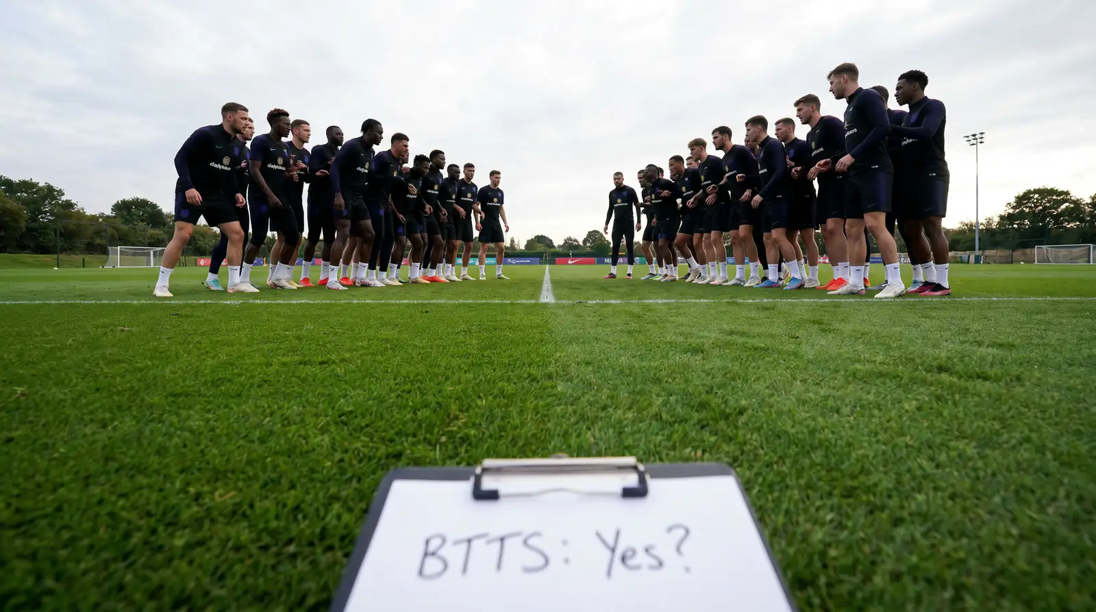 Two defensive sides setting up a low-block tactical formation on a football pitch