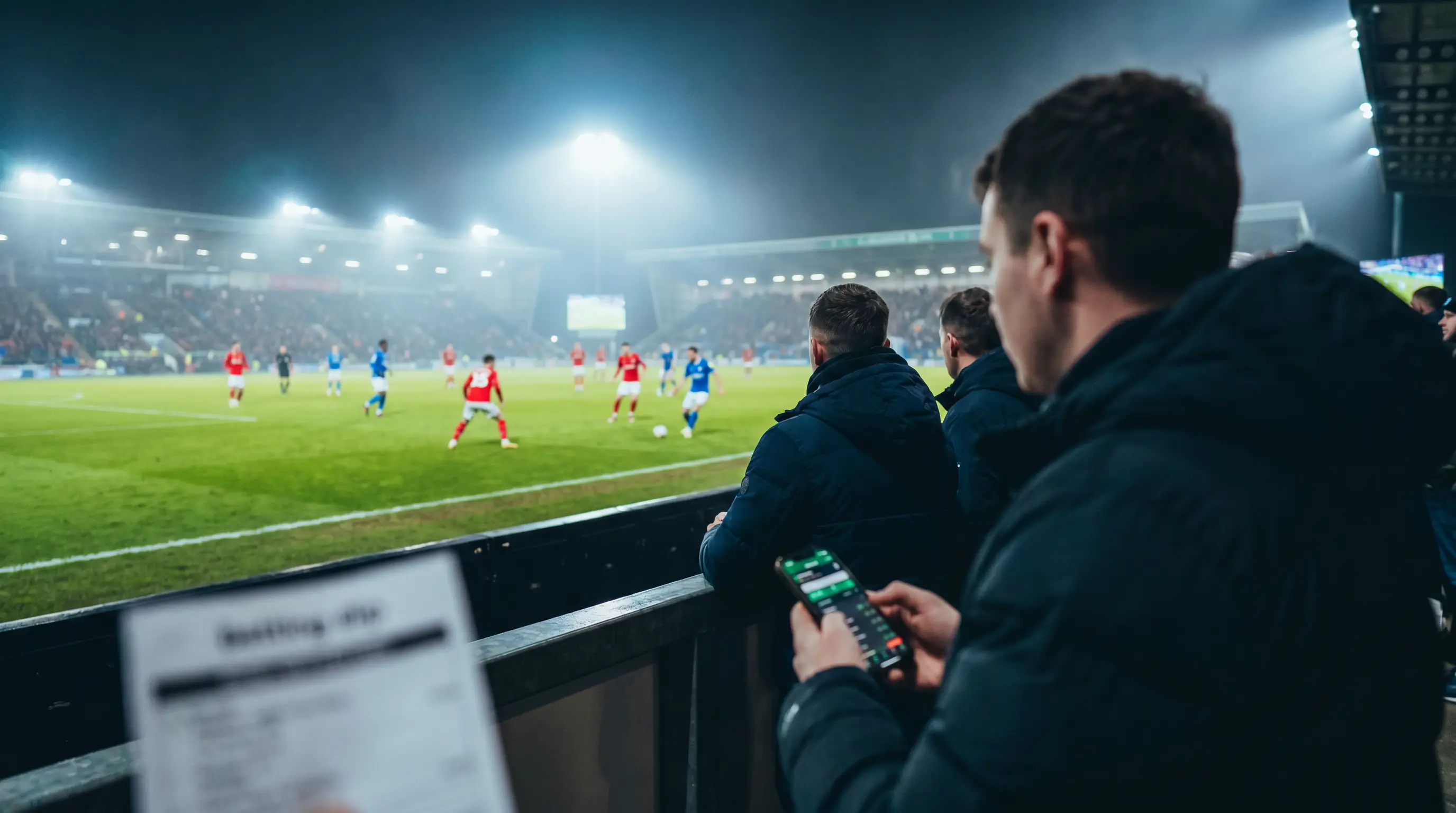 Premier League team facing an EFL Championship side under cup-tie floodlights